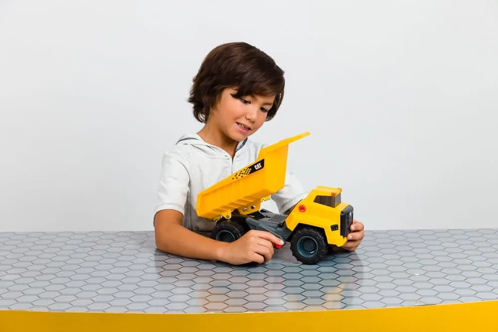 CAT Construction Toys, Power Haulers 2.0 Dump Truck, Realistic Lights and Sounds, Motion Drive Technology, Working Features, & Realistic Construction Experience.