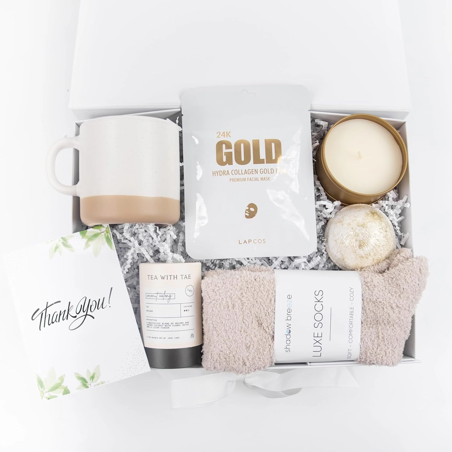 Cozy White/Gold Gift Box for Women | Relaxing Self-Care Package with Ceramic Mug, Scented Candle in a Gold Tin, 24K Gold Face Mask, Plush Socks, Bath Bomb, Tea Sampler & Card (Thank You)