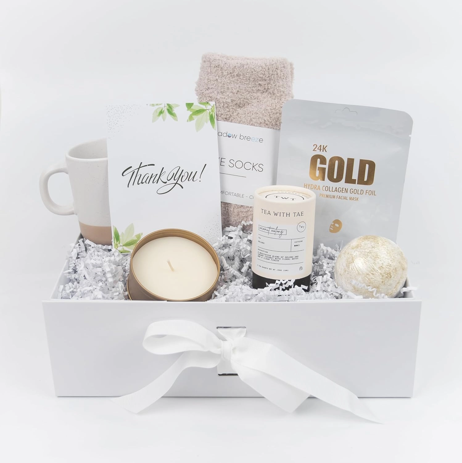 Cozy White/Gold Gift Box for Women | Relaxing Self-Care Package with Ceramic Mug, Scented Candle in a Gold Tin, 24K Gold Face Mask, Plush Socks, Bath Bomb, Tea Sampler & Card (Thank You)