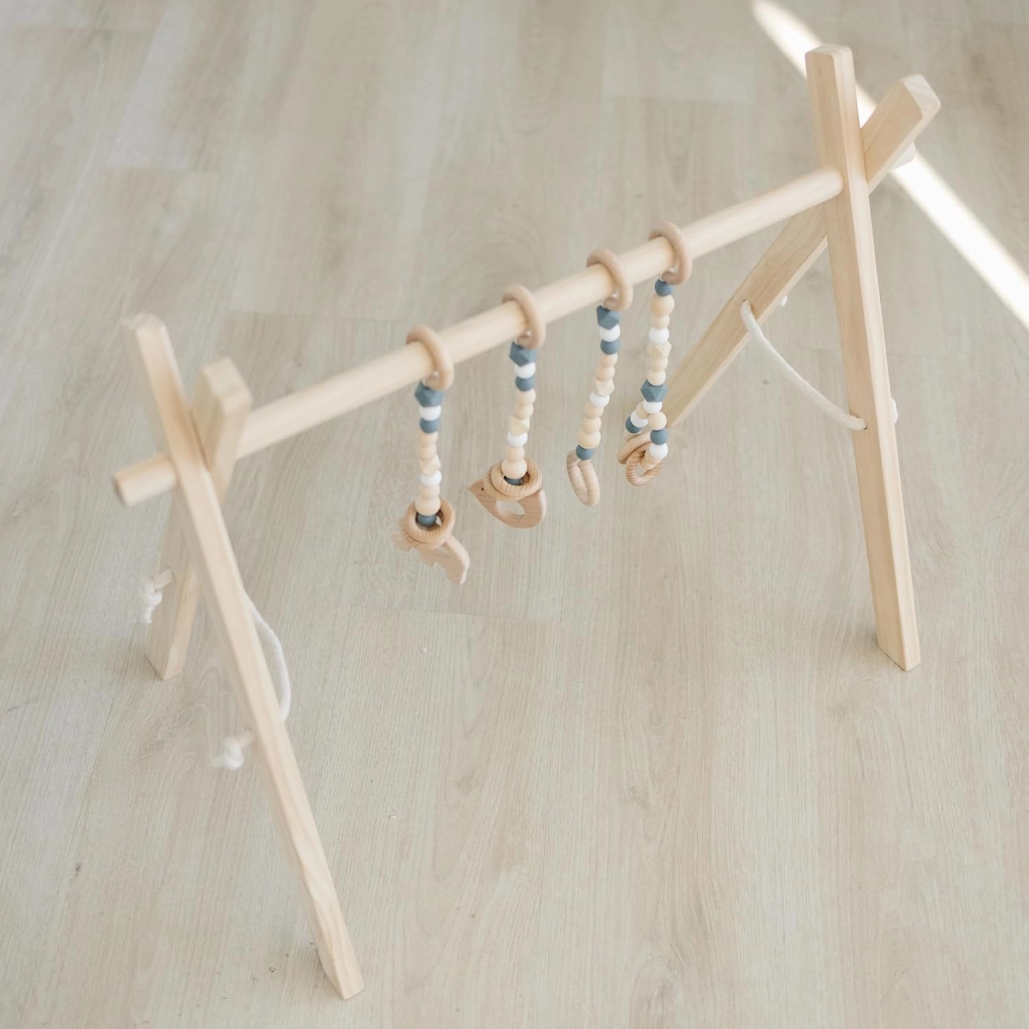 Poppyseed Play - Wooden Baby Play Gym, Montessori Activity Center w/Hanging Beech Wood Toys, Foldable Natural Pine Wood Frame, Portable Infant Play Gym, Motor Skill Development & Modern Nursery Decor